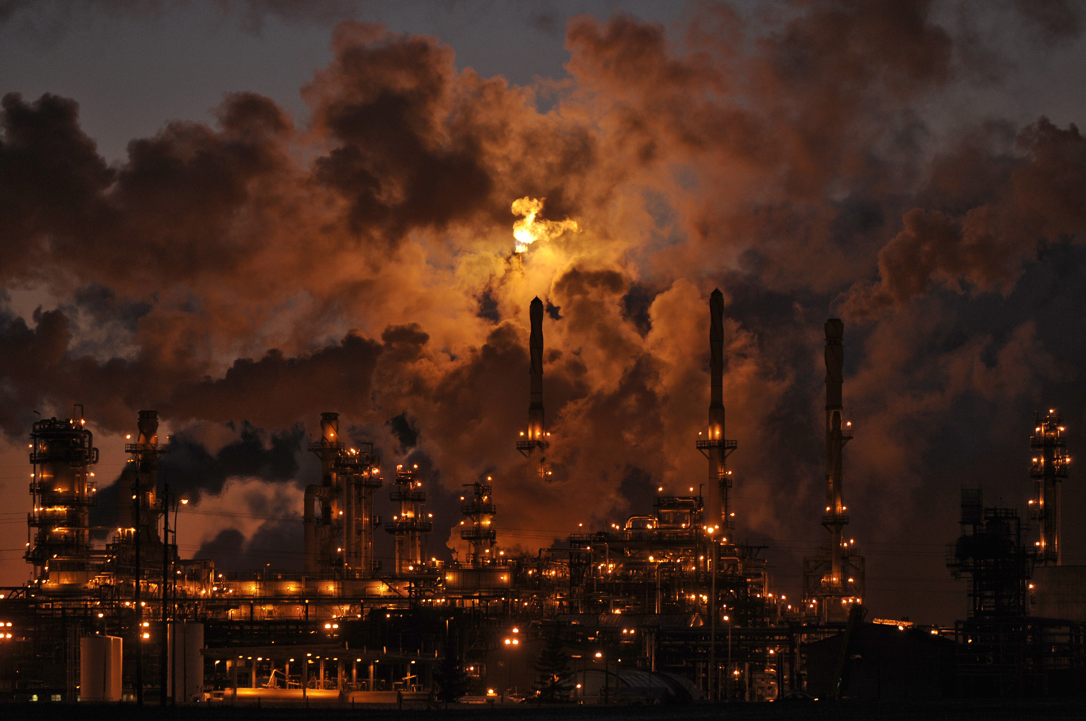 Petro-Canada’s oil refinery glows at dusk in Edmonton