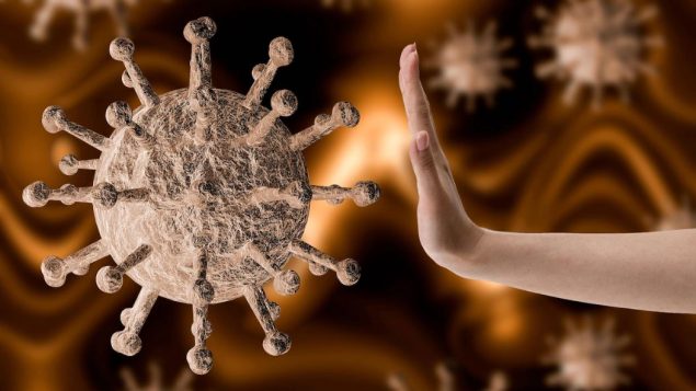 كوفيد 19 هو مرض معد تسببه فيروسات تاجية ظهرت في الصين في ديسمبر كانون الأول الماضي وينتشر حاليًا في جميع أنحاء العالم - iStock