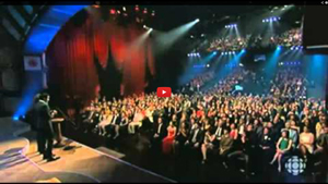 Video of comedians Sugar Sammy and Simon-Olivier Fecteau roast each other and comics in attendance at 2013 Olivier comedy awards.