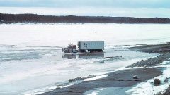 A heavy truck takes a risk to cross a deterioting ice road near Ft Simpson NWT. (Terry D Prowse-NRCAN)