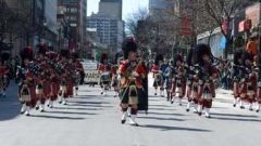 No parade in Canada can be a success without the Pipes and Drums, here Montreal's Royal Highland Regiment-(RHR) Black Watch, one of the dozens of pipe and drum and other marching bands  from several locations across Canada and the US who participate each year. (Photo Don McCabe) CLICK TO ENLARGE