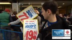 This Toronto school teacher was happy to have bought a couple of signs. An English teacher he liked the incorrectly spelled "sox" and "hoodys" (CBC) CLICK TO ENLARGE