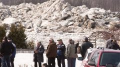 Residents at St Lambert de lauzon watch a huge pile up of ice floating on the Chaudiere River south of Quebec City. Several households were evacuated on Monday, (photo:Jacques Boissinot-Canadian Press) CLICK to ENLARGE
