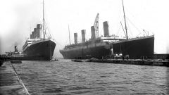 The Titanic (R) has been moved out of the drydock to make way for Olympic which requires repairs. This results in a faterful dealy of Titanic's maiden voyage, from March to April. (Harland & Wolff) CLICK to ENLARGE)