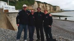 The teacher chaperones on the battlefield trip standing on the pebble beach at Dieppe. Carrying heavy loads, and wearing hob-nail boots the soldiers had to run over the slippery footing in the face of incredible fire against them. These particular extra hard rocks also jammed in the tank track and broke them, virtually eliminating tank support in the disastrous Dieppe raid of 1942 (CLICK to enlarge)