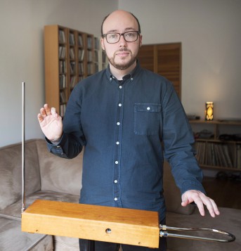 Author Sean Michaels poses for a photograph next to a Theremin at his home in Montreal, Friday, October 24, 2014. (Photo credit: THE CANADIAN PRESS/Graham Hughes)