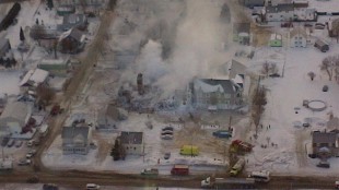 An aerial police photo shows the burned remnants of a seniors' residence that was only partly equipped with a water sprinkler system.Thirty-two residents died in the January 23, 2014 fire. (Photo Credit: Sûreté du Québec)