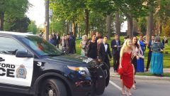 wearing formal dress, theatre goers are evacuated from the grounds of the Festival Theatre in Stratford Ontario