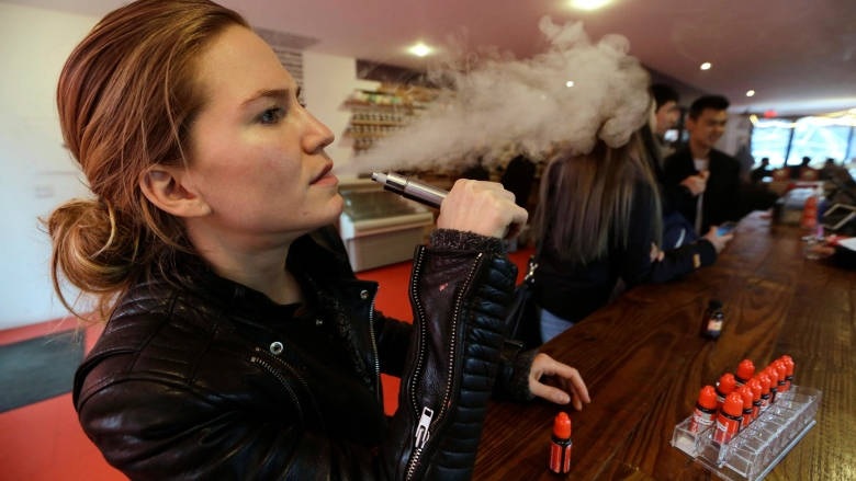 person using e-cigarette.