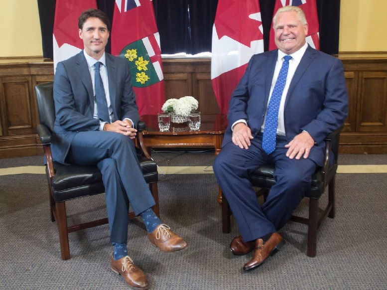 Still smiling as they sit to discuss issues. Ford had already thrown down the gauntlet on illegal migrants, and the carbon tax issue. Some accounts say the meeting was "superheated