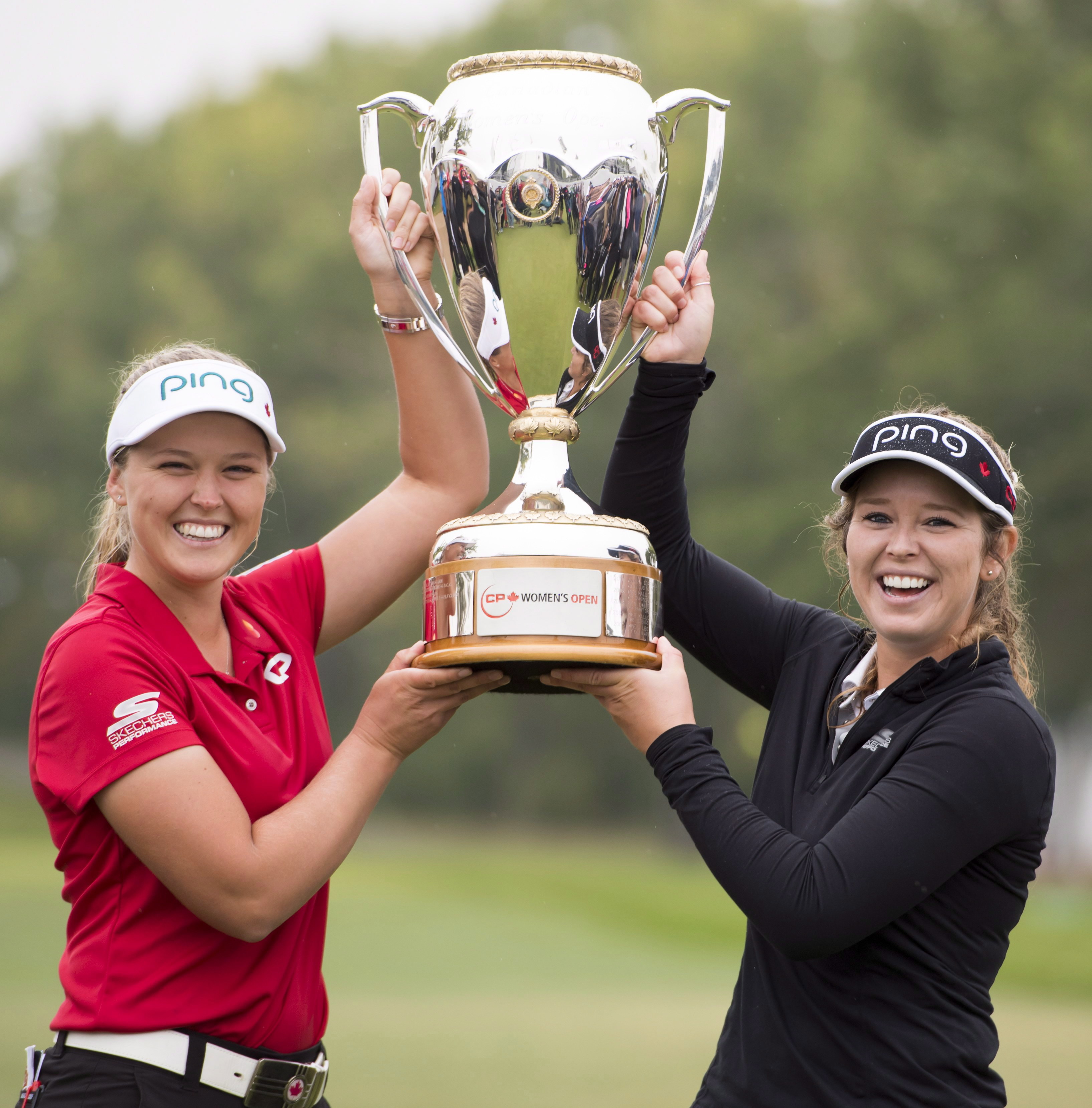 Brooke Henderson left, and her sister, Brittany, who caddied for her Brooke