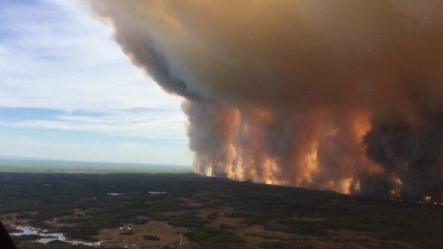 The fire known as the Chuckegg Creek fire is seen from the air in a Government of Alberta handout photo taken near the town of High Level, Alta., Sun. May 19. (Gov't of Alberta-via Canadian Press)