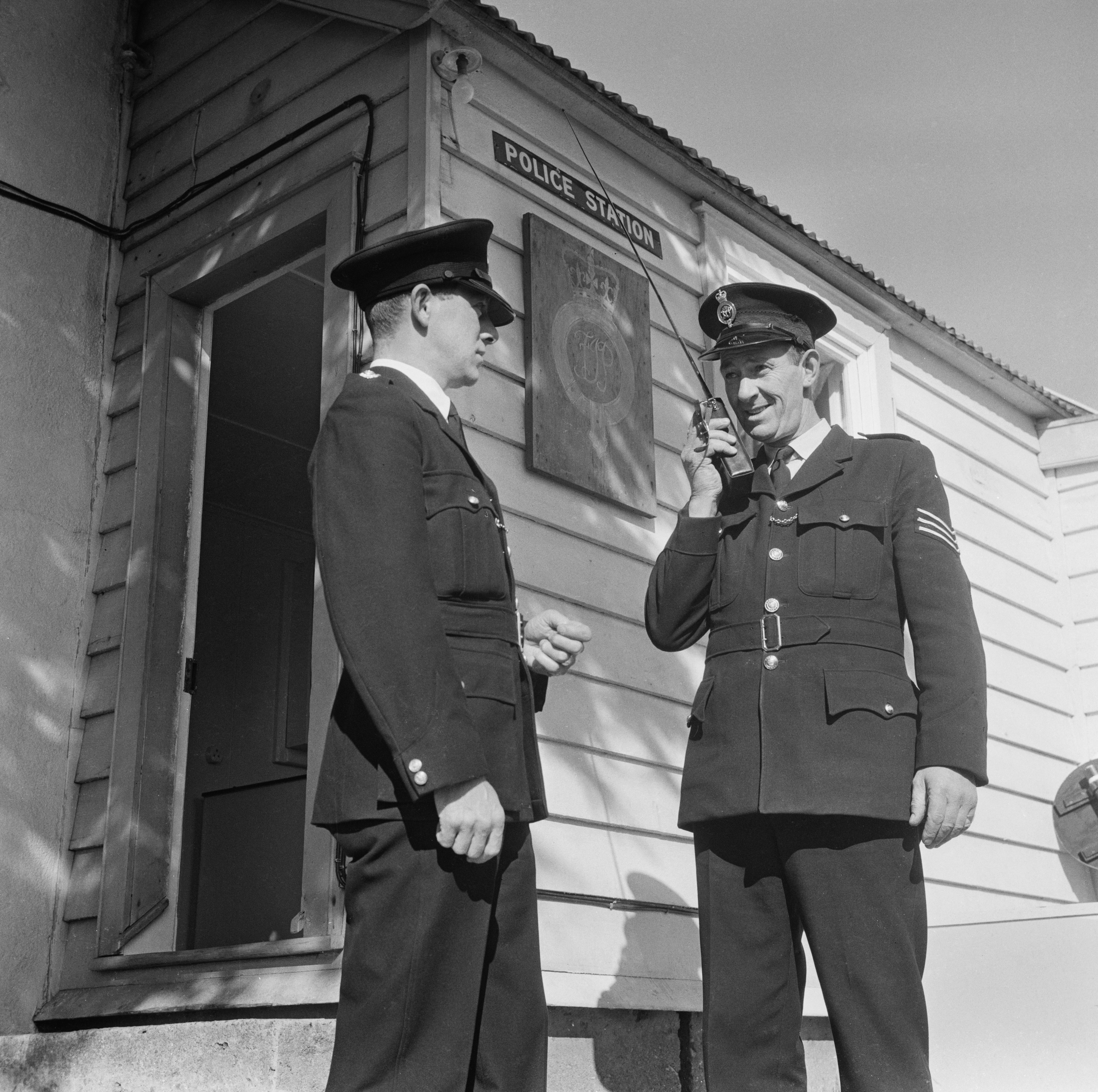 Chief inspector Terry Peck and a police officer outside a Police Station in Stanley, UK, 21st October 1968. (Photo by Aubrey Matthews/Daily Express/Getty Images)