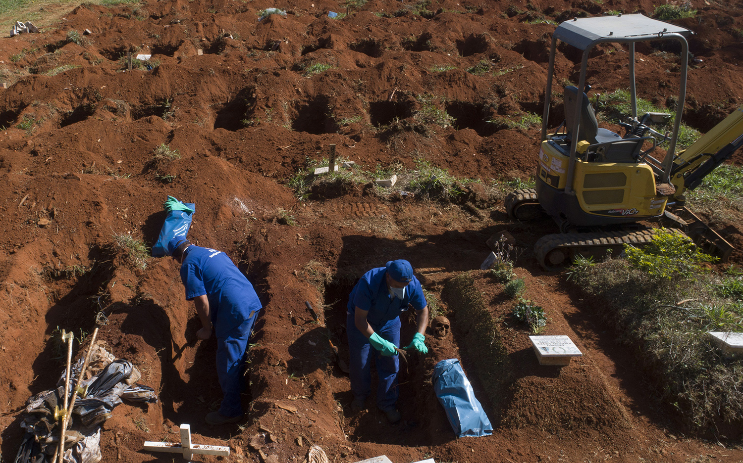 cemetery-workers-exhume-the-remains-at-a-cemetery-in-sao-paulo-brazil