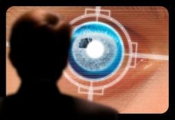 Man viewing a retinal eye scan on a video monitor