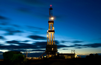 Oil rig at night. Photo courtesy Alaska Dispatch.