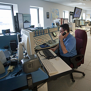 A member of the Canadian Coast Guard sits in the Marine Communications and Traffic Service operation in Iqaluit, Nunavut. Canada has beefed up its Arctic presence in recent years. (Andy Clark/Reuters)