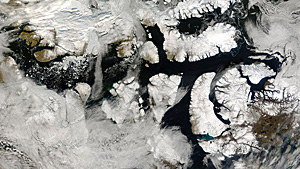 An ice-free Northwest Passage is seen in this handout satellite photo. Low ice levels are spurring dreams of commercial shipping in the region. (NASA)