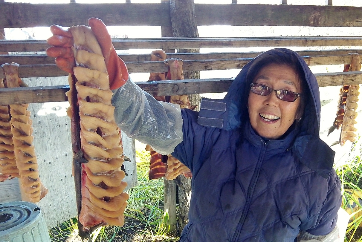 Olia Sutton drying salmon in Naknek in 2011. This is a screen shot from a rural video contest in fall 2011 called 