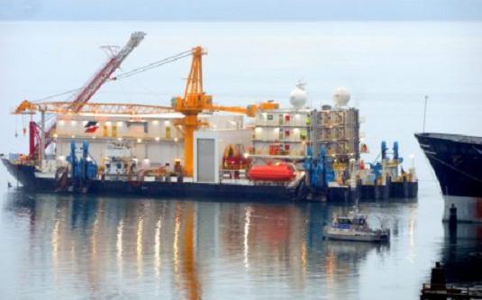 The Arctic Challenger with the newly redesigned and repaired Containment Dome move away from the Port of Bellingham, Wash. on Dec. 12. 