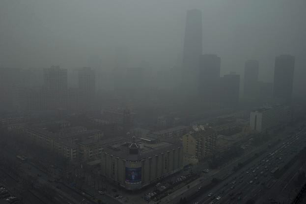 Skyscrapers are obscure by heavy haze in Beijing Sunday, Jan. 13, 2013. Experts are raising concerns about pollution in some parts of Finland. (AP Photo/Ng Han Guan) 