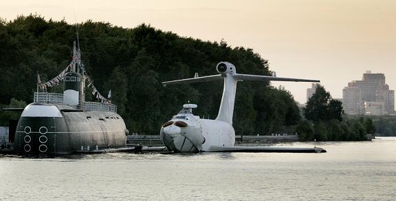 The Soviet built Orlyonok type ekranoplan is anchored near a submarine on Khimkinskoye reservoir. Ekranoplans, also known in the West as Ground effect vehicles or Wing in surface effect ships, fly only a few meters above any flat surface, usually the water surface, saving energy. Photo: Ivan Sekretarev, AP Photo. 