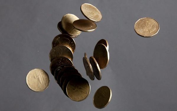 The Canadian dollar (loonie). Photo: Jonathan Hayward, The Canadian Press.