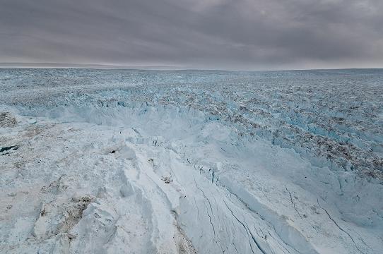 In part because the large Jakobshavn Isbrae moves so quickly, it is difficult to tell the glacier ice (right and top) from the many icebergs it has calbed off (centre front) into the fjord. Photo courtesy: Ian Joughin. Alaska Dispatch. In part because the large Jakobshavn Isbrae moves so quickly, it is difficult to tell the glacier ice (right and top) from the many icebergs it has calbed off (centre front) into the fjord. (Courtesy Ian Joughin / Alaska Dispatch)