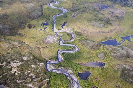  The Canadian PressHarper Arctic 20120821 03150243A river runs through a valley near Moose Ponds in Canada's Northwest Territories. THE CANADIAN PRESS/Adrian Wyld