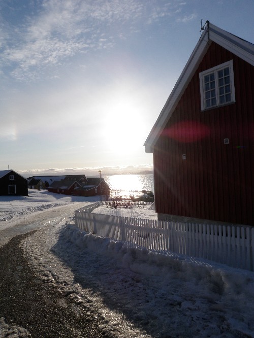 Sun sets in Nuuk's old harbour area. Photo Eilís Quinn