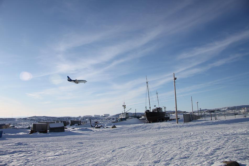 Airplane flying in over Frobisher Bay, Iqaluit. Photo Levon Sevunts