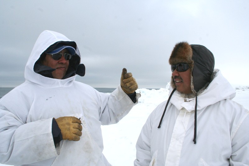 Siku - Inuit - Hila hunters Joe Leavitt and Joelie Sanguya talk on sea ice edge near Barrow, Alaska. Photo courtesy Shari Gearheard