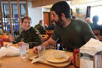 Tom Smithengale enjoying a lunch with Canadian Forces medical technician Master Corporal Fran Vollhoffer, who's been taking care of him since his arrival. Photo Levon Sevunts