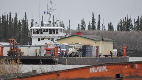The Northern Transportation Company Ltd. barge transporting the beige mosque down the Mackenzie River docked in Inuvik, N.W.T., late Wednesday afternoon. (Philippe Morin/CBC)