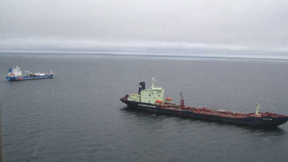 The grounded tanker MV Nanny, left, is joined by another Woodward's Oil tanker, MV Tuvaq, in this photograph taken aboard a coast guard helicopter on Monday afternoon. (Canadian Coast Guard)
