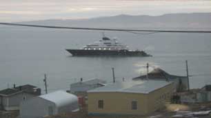The luxury mega-yacht Octopus was parked offshore from Pond Inlet, Nunavut, for five days before slipping away on Monday. (Submitted by Colin Saunders)
