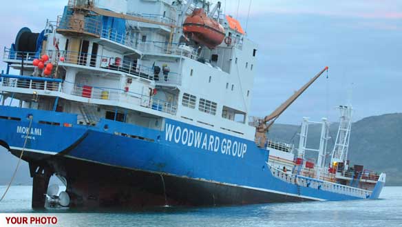 This fuel tanker ran aground in the harbour at Pangnirtung, Nunavut, during low tide on Sunday. No fuel spilled from the vessel, according to officials. (Submitted by David Kilabuk)