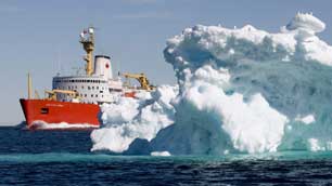 The Canadian Coast Guard icebreaker Louis S. St-Laurent sails past a iceberg in Lancaster Sound as part of a sovereignty and research patrol through Canada's Arctic in July 2008. (Jonathan Hayward/Canadian Press)