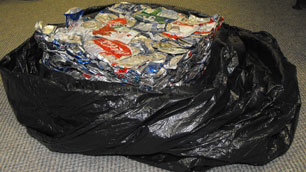 Flattened beverage containers ready to be shipped from Rankin Inlet, Nunavut. Pilot programs in Rankin Inlet and Iqaluit will end in December, after Nunavut government officials determined that making recycling a territory-wide program would be too costly. (Jackie Sharkey/CBC)