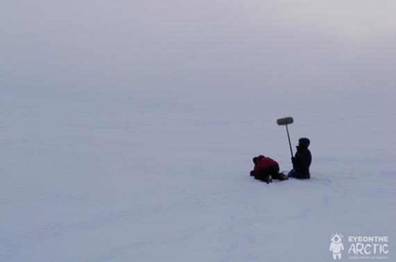 Eye on the Arctic crew filming on sea ice near Clyde River, Nunavut, Canada. Photo: Eilís Quinn, Radio Canada International.