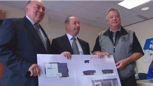 N.W.T. Industry, Tourism and Investment Minister Bob McLeod, left, stands with Crossworks president Uri Ariel and Yellowknife Mayor Gordon Van Tighem at the company's unveiling of a 'diamond promotion centre' that will open in the city's downtown in January. Photo CBC.