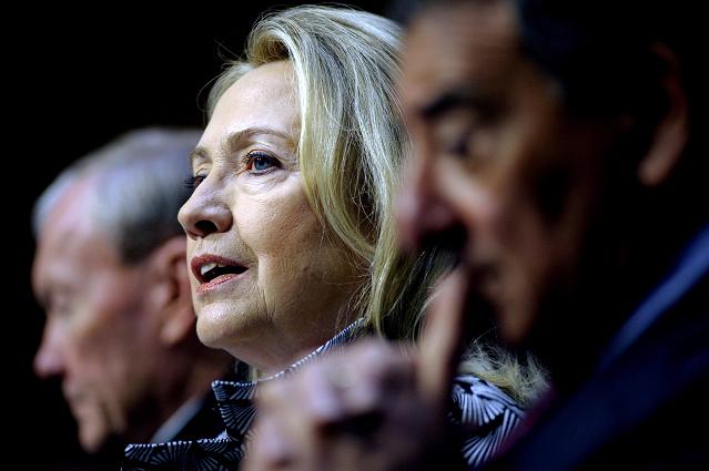 U.S. Secretary of State Hillary Rodham Clinton, center, accompanied by Defense Secretary Leon Panetta, right, and Joint Chiefs Chairman Gen. Martin E. Dempsey, testifies on Capitol Hill in Washington, Wednesday, May 23, 2012, before the Senate Foreign Relations Committee hearing on The Law of the Sea Convention. (AP Photo/Cliff Owen)