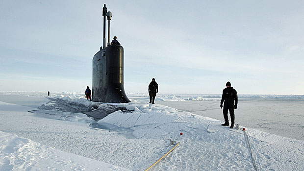 U.S. Navy divers on the deck of the USS New Hampshire after it surfaced in the Arctic Ocean north of Prudhoe Bay, Alaska, in March 2011. Photo by Lucas Jackson, Reuters. 