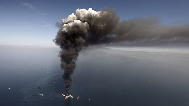 An oil spill at BP's Deepwater Horizon offshore oil rig in the Gulf of Mexico in April 2010 has cost $40 billion to clean up. Canada currently limits corporate liability for offshore oil spills to $30 million or $40 million, but the federal government is working on a bill to increase that cap. (Gerald Herbert/Associated Press)