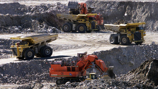 Heavy haulers and excavators work in the Diavik diamond mine pit on Lac de Gras, approximately 300km northeast of Yellowknife. (Adrian Wyld/The Canadian Press)