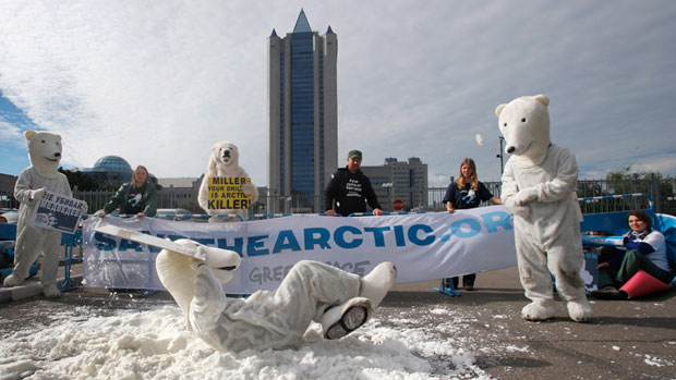 Greenpeace activists dressed as polar bears protest outside Gazprom's headquarters in Moscow, Russia, Wednesday, Sept. 5, 2012. Russian and international environmentalists are protesting against Gazprom's plans to pioneer oil drilling in the Arctic. (Misha Japaridze/AP Photo)