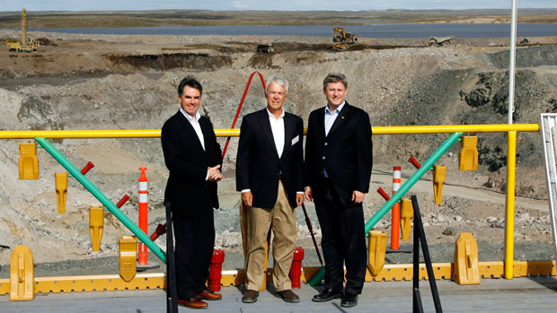 Prime Minister Stephen Harper, right, poses with then-Indian and Northern Affairs Minister Jim Prentice, left, and Tahera Diamond CEO Peter Gillin, in front of the mining pit before the official opening of the Jericho Diamond Mine project on Thursday, August 17, 2006, in Nunavut. Shear Diamonds bought the mine in 2010 after Tahera went bankrupt.) (CP PHOTO/Jeff McIntosh)