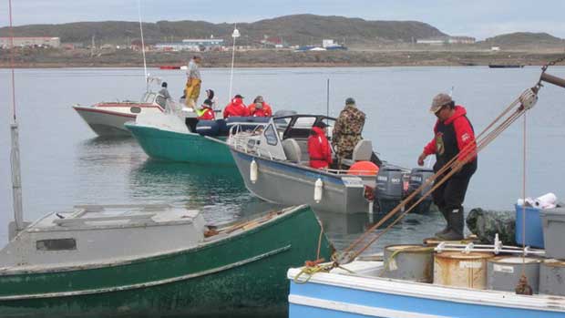 Iqaluit bowhead whale hunters depart in boats from the local breakwater on Monday morning. Photo Peter Sheldon, CBC.