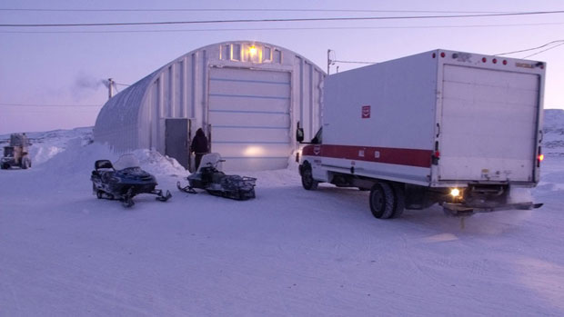 Earlier this year, a tidal surge caused salt water to flow into the community's drinking water supply. They were using this building to store fresh water for the time being. (CBC file/Stephan Inaksajak)