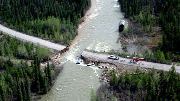 A view of the Nahanni Range Road, which was washed out in several parts last month after heavy rainfall and washouts. Part of the Dempster Highway in Yukon is closed today due to heavy rainfall. The weather is hampering maintenance crews who are working to repair parts of the highways. (CBC)